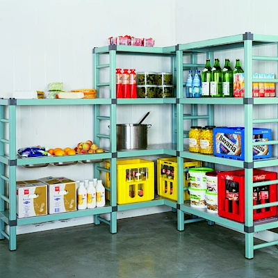 Plastic shelving full of stock in a walk in cold room